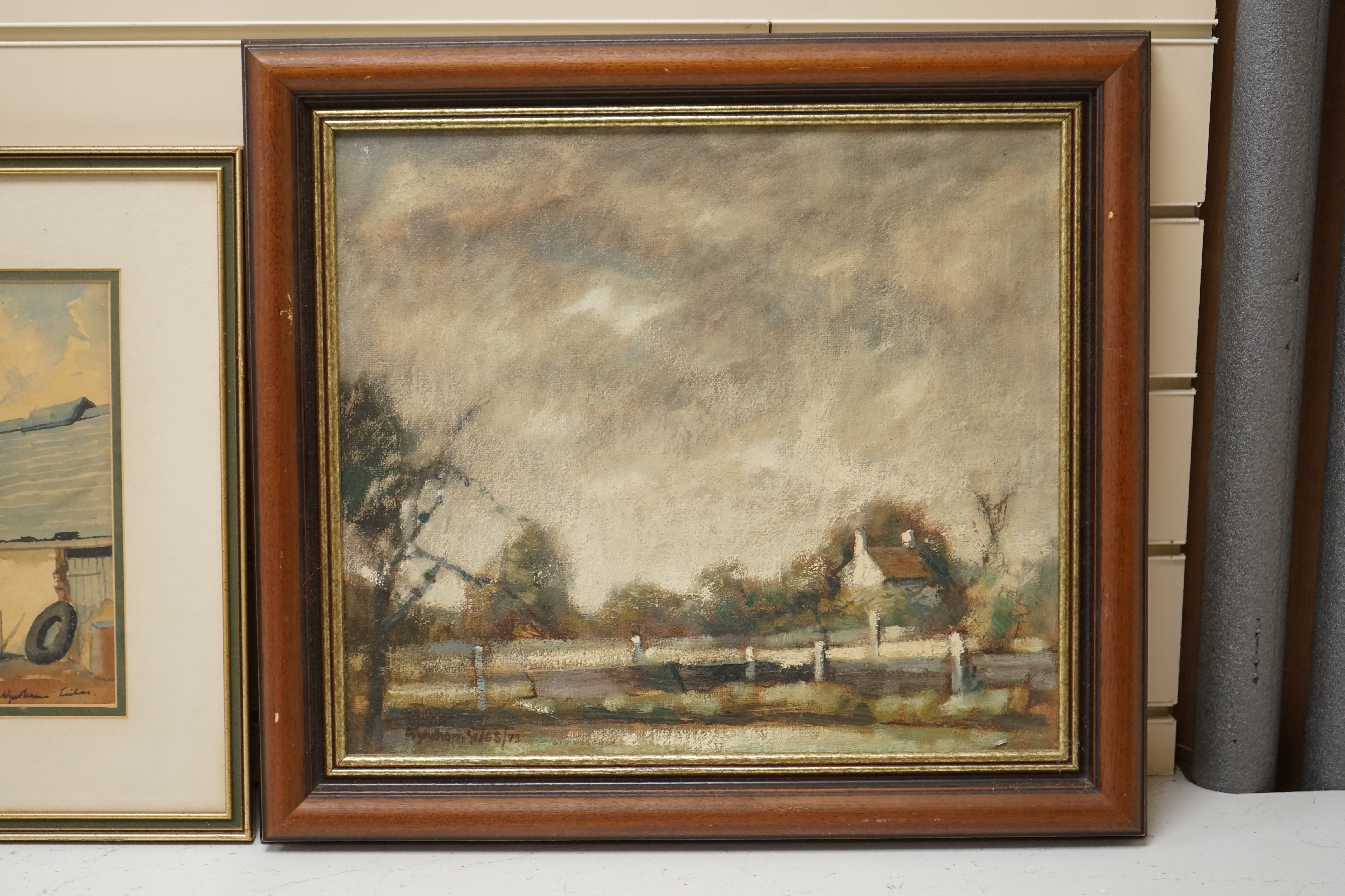 Wyndham Edwin George Giles, an oil on canvas, Stormy landscape, signed and dated ‘72, together with a watercolour by the same artist, ‘Farm Buildings, Staffordshire’, largest 34 x 39cm. Condition - fair to good